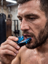 RESFIT Mouth Guard Pro realistic MMA athlete lifestyle with blue black mouthguard