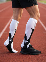 Runner wearing RESFIT Advanced Compression Socks on track